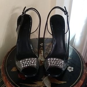 Black Guess clear ornament design on top of Heels